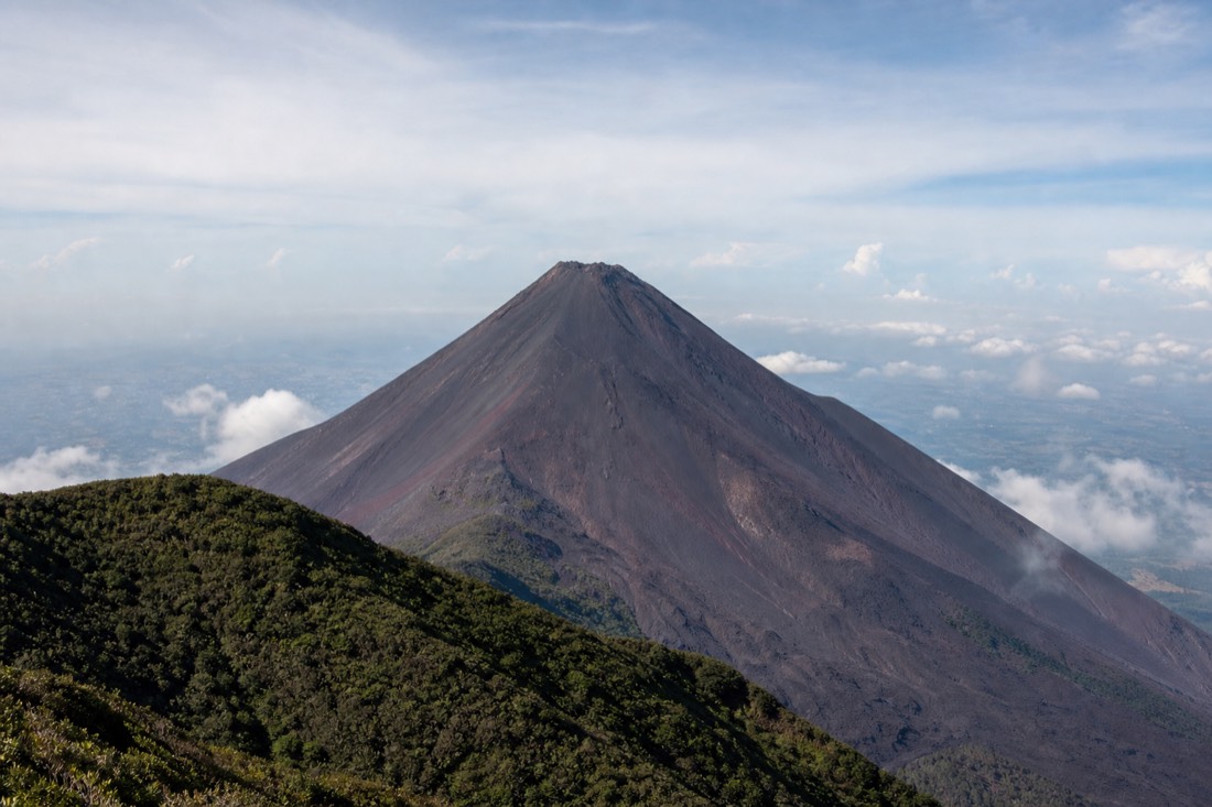 The dark cone of Izalco volcano seen from the upper slopes of Santa Ana Volcano